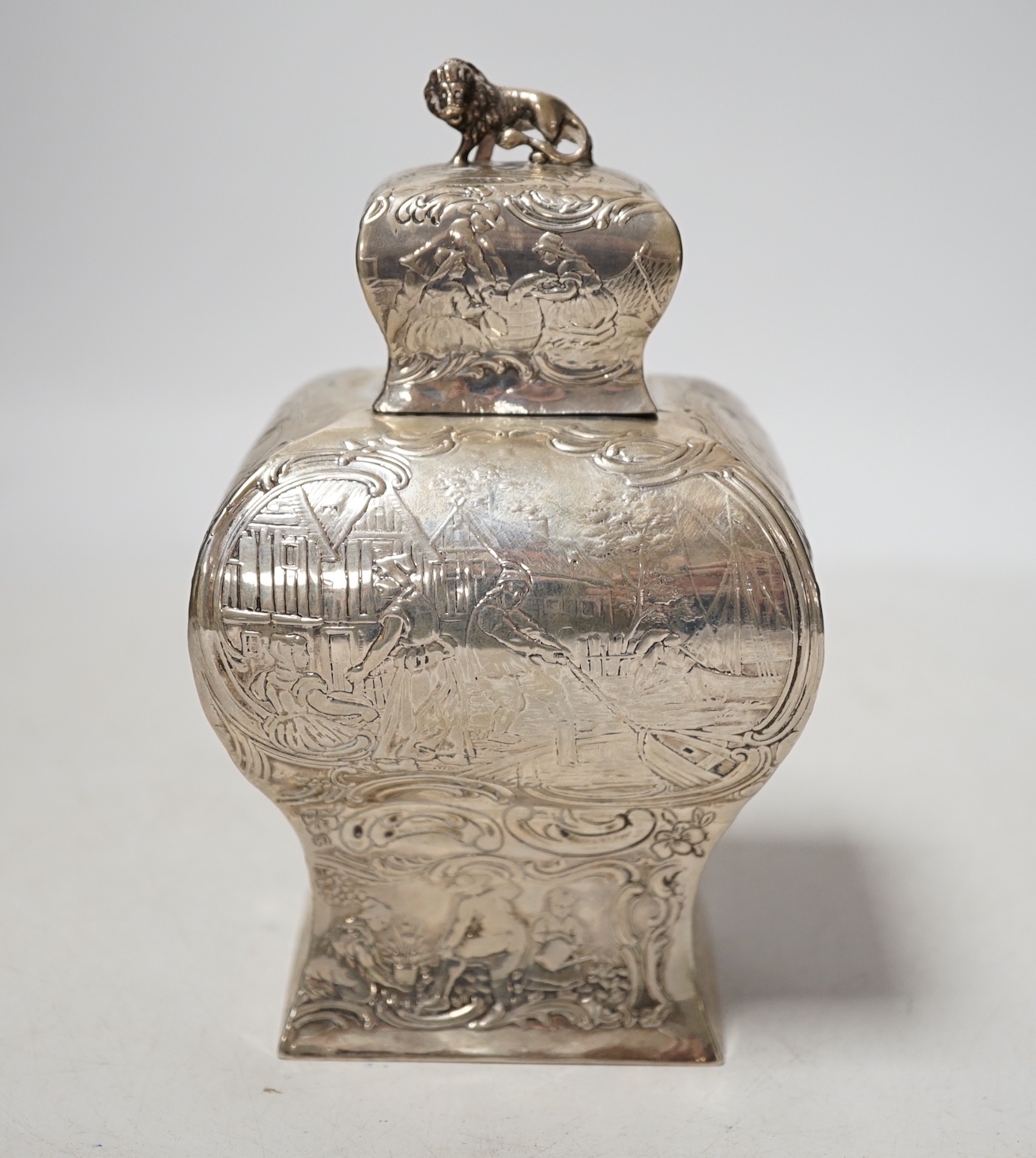 A late 19th century Hanau embossed white metal bombe shaped tea caddy, with lion en passant finial, 13.8cm, 5.5 oz.